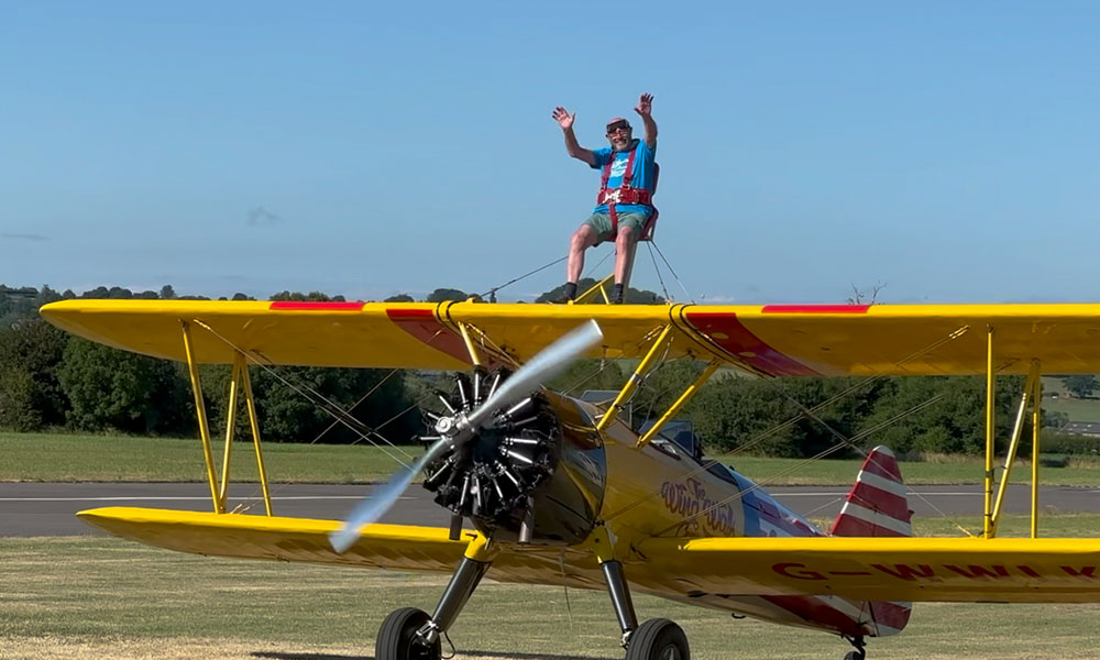 Gutsy grandad Rev John Dawson, 80, completes fundraising wing walk.